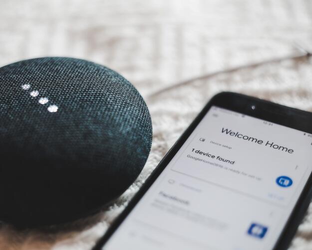 Bluetooth speaker lying next to phone