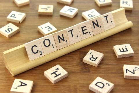 Scrabble letters spelling out the word "content"