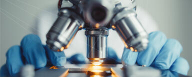 Memetic Communications produces precision content to create sales conversions Close-up of a microscope being used by a scientest